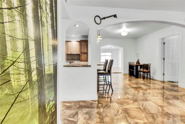 kitchen featuring pendant lighting and kitchen peninsula