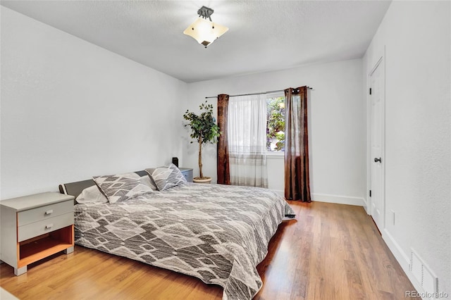 bedroom featuring hardwood / wood-style flooring