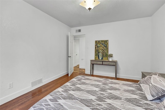 bedroom featuring hardwood / wood-style floors