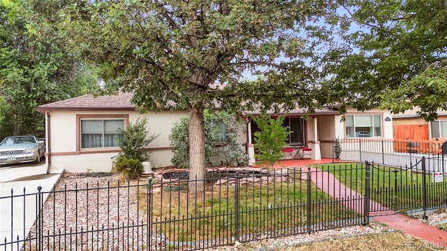 view of front of property with a front lawn