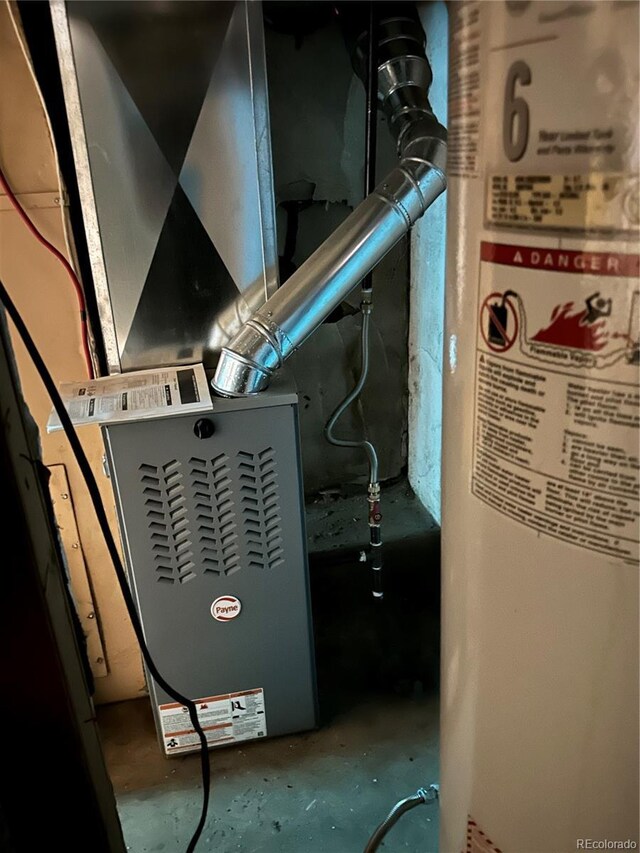 utility room with gas water heater