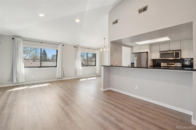 540 S Forest St Unit 3-204, Denver, CO 80246 - kitchen featuring dark countertops, appliances with stainless steel finishes, and visible vents