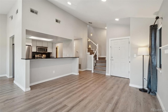 540 S Forest St Unit 3-204, Denver, CO 80246 - interior space featuring dark countertops, appliances with stainless steel finishes, recessed lighting, light wood-type flooring, and visible vents