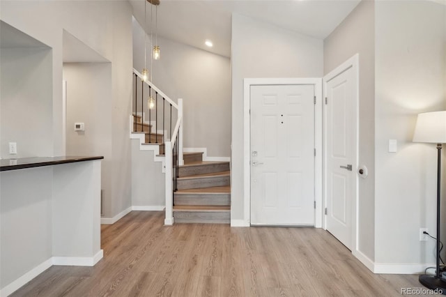540 S Forest St Unit 3-204, Denver, CO 80246 - entryway with baseboards, recessed lighting, light wood-style flooring, and stairs