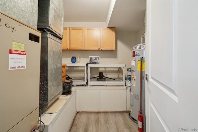 540 S Forest St Unit 3-204, Denver, CO 80246 - washroom featuring light wood-type flooring and water heater