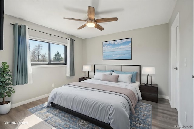 540 S Forest St Unit 3-204, Denver, CO 80246 - bedroom with baseboards, ceiling fan, and wood finished floors