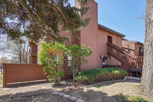 540 S Forest St Unit 3-204, Denver, CO 80246 - view of side of home featuring fence and stairs