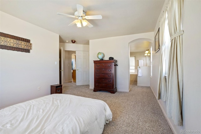 17950 Cumbres Rd, Peyton, CO 80831 - carpeted bedroom with arched walkways, baseboards, and ceiling fan