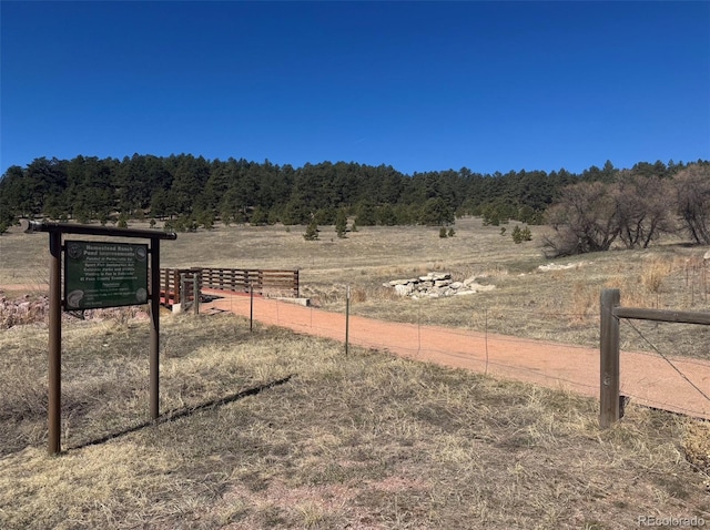 17950 Cumbres Rd, Peyton, CO 80831 - view of yard featuring a view of rural / pastoral area, fence, and a wooded view