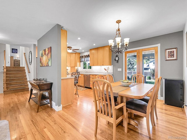 6810 S Marion Cir W, Centennial, CO 80122 - dining room with light wood finished floors, a chandelier, stairs, and recessed lighting