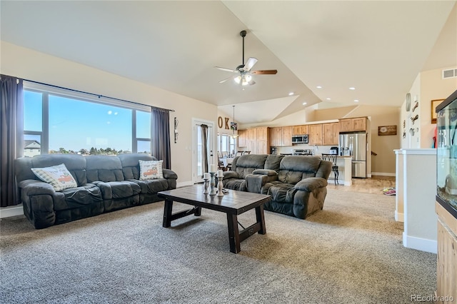 carpeted living room with vaulted ceiling and ceiling fan