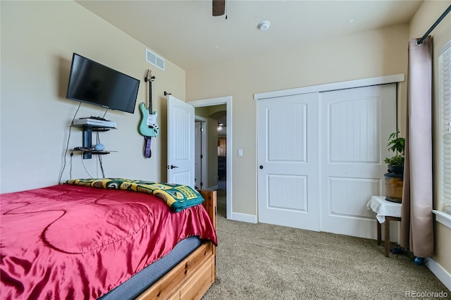 bedroom featuring carpet floors, a closet, and ceiling fan