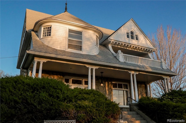 view of front of house with a garage and a balcony