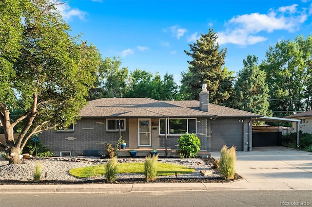 4100 Shaw Blvd, Westminster, CO 80031 - single story home featuring an attached garage, concrete driveway, a chimney, brick siding, and an attached carport