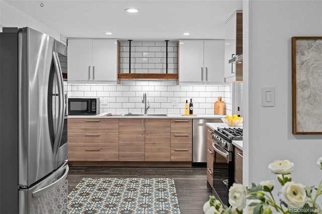 4100 Shaw Blvd, Westminster, CO 80031 - kitchen featuring appliances with stainless steel finishes, light countertops, open shelves, modern cabinets, and white cabinets