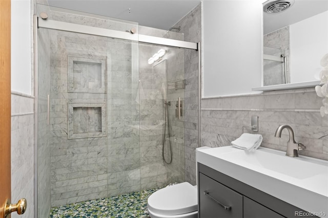 4100 Shaw Blvd, Westminster, CO 80031 - full bath featuring vanity, a shower stall, and tile walls