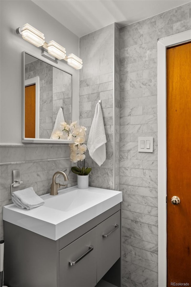 4100 Shaw Blvd, Westminster, CO 80031 - bathroom with vanity and tile walls