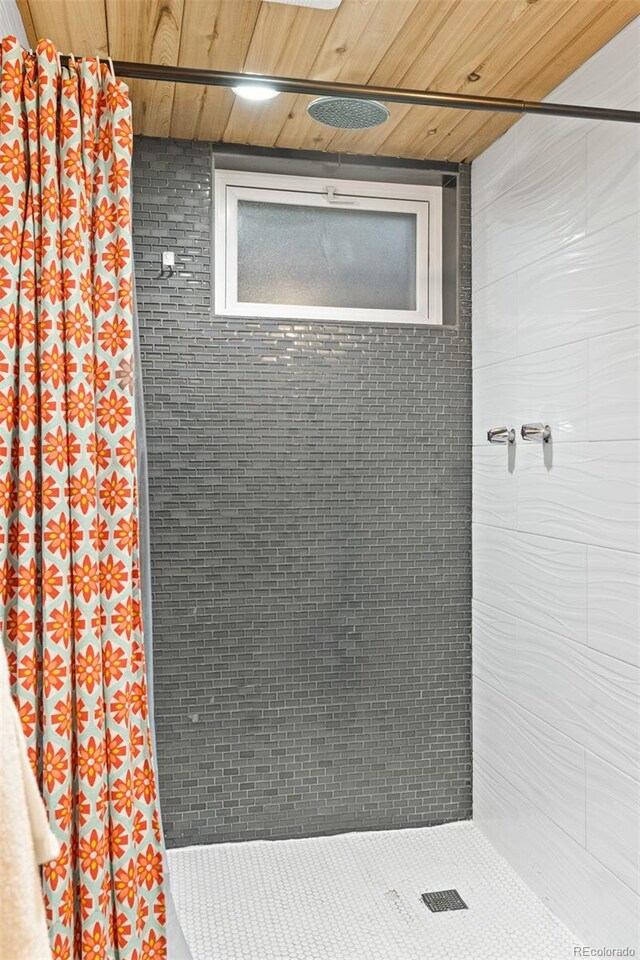 4100 Shaw Blvd, Westminster, CO 80031 - full bathroom featuring a tile shower and wood ceiling
