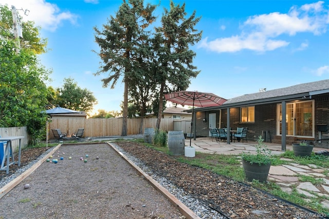 4100 Shaw Blvd, Westminster, CO 80031 - fenced backyard with a bocce ball area and a patio area