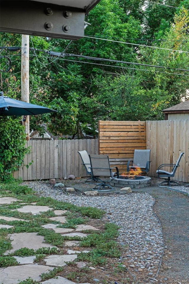 4100 Shaw Blvd, Westminster, CO 80031 - view of yard with an outdoor fire pit and a patio area