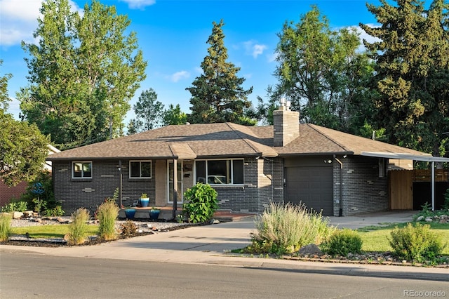 4100 Shaw Blvd, Westminster, CO 80031 - ranch-style home with a garage, brick siding, concrete driveway, a chimney, and roof with shingles