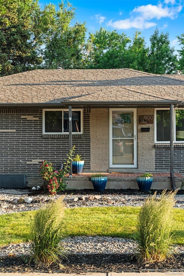 4100 Shaw Blvd, Westminster, CO 80031 - view of front of property with brick siding and a shingled roof