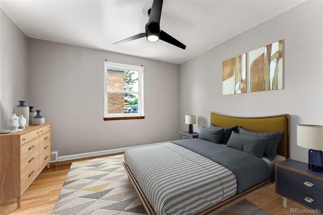 1535 Hudson St Unit 1, Denver, CO 80220 - bedroom featuring light wood finished floors, ceiling fan, and baseboards