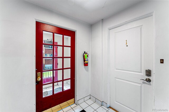 1535 Hudson St Unit 1, Denver, CO 80220 - entryway featuring light tile patterned floors and baseboards