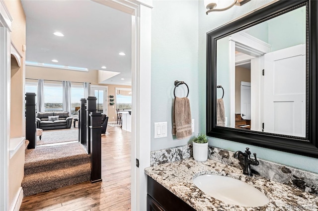 bathroom with wood-type flooring and vanity