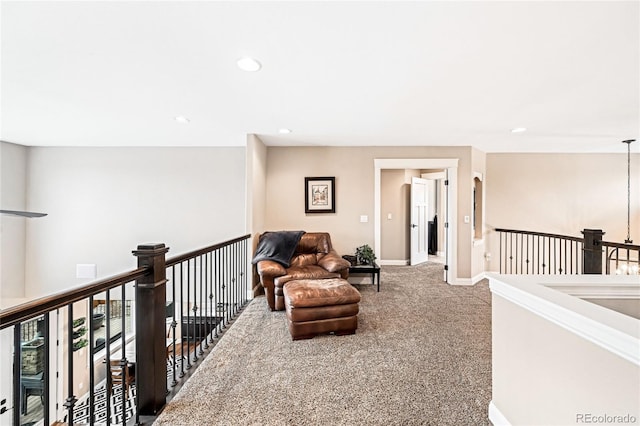 sitting room with light colored carpet