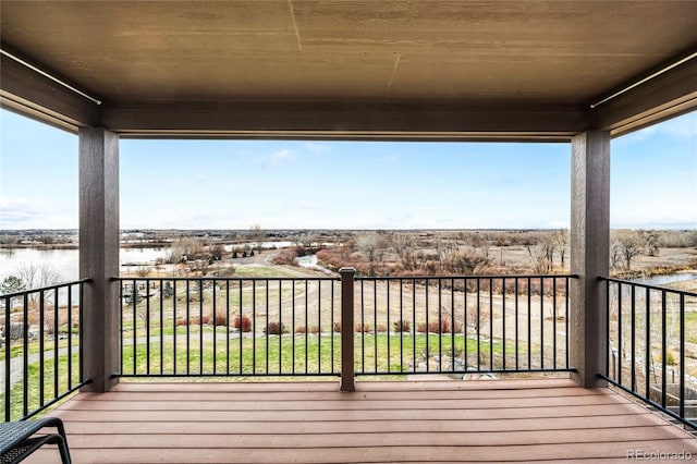 wooden terrace with a water view