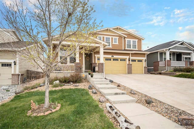 6173 Eldora St, Golden, CO 80403 - craftsman inspired home featuring a porch, brick siding, concrete driveway, and an attached garage