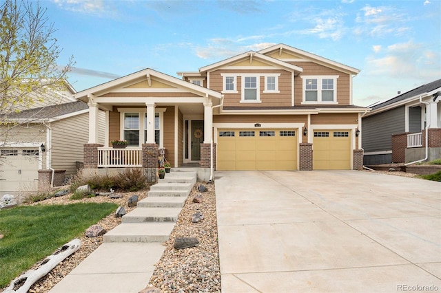 6173 Eldora St, Golden, CO 80403 - craftsman inspired home featuring a porch, a garage, brick siding, and driveway