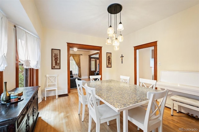 1430 Monroe St, Denver, CO 80206 - dining space featuring plenty of natural light, light wood-style floors, and baseboards