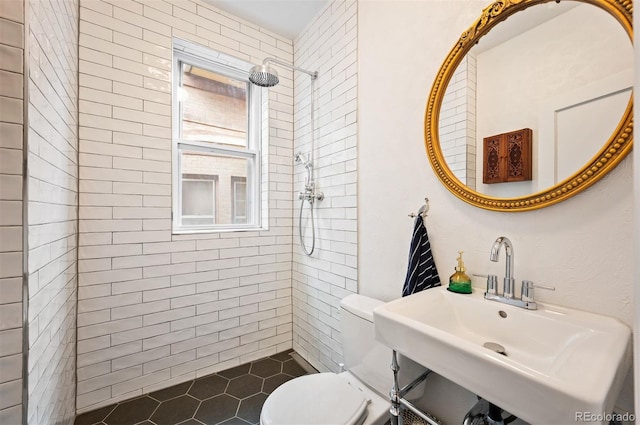 1430 Monroe St, Denver, CO 80206 - bathroom with toilet, a tile shower, a sink, and tile patterned floors