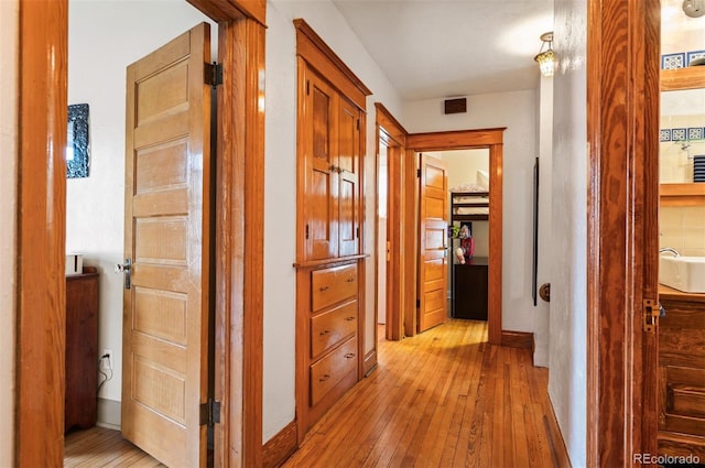 1430 Monroe St, Denver, CO 80206 - hallway featuring light wood-style floors and baseboards