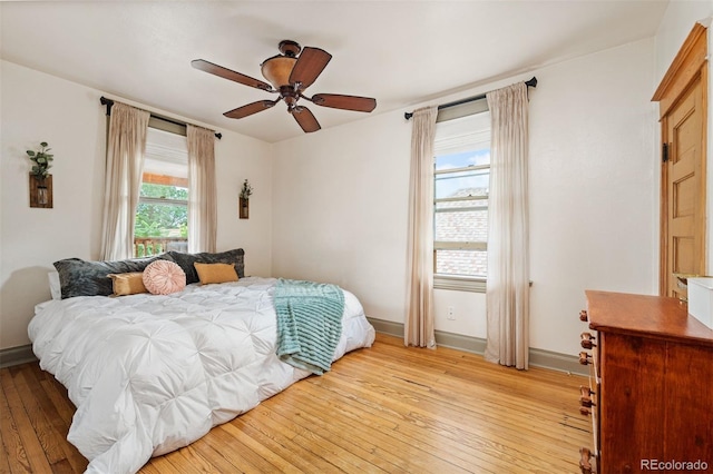 1430 Monroe St, Denver, CO 80206 - bedroom with light wood-type flooring, baseboards, and a ceiling fan