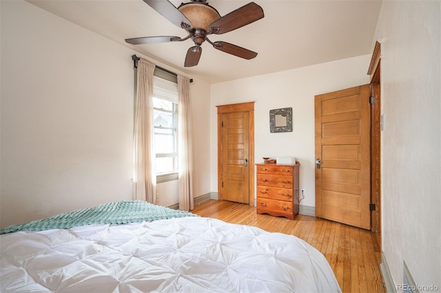 1430 Monroe St, Denver, CO 80206 - bedroom with light wood-style flooring, a ceiling fan, and baseboards