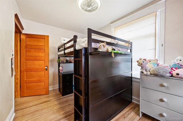 1430 Monroe St, Denver, CO 80206 - bedroom featuring wood finished floors, baseboards, and multiple windows