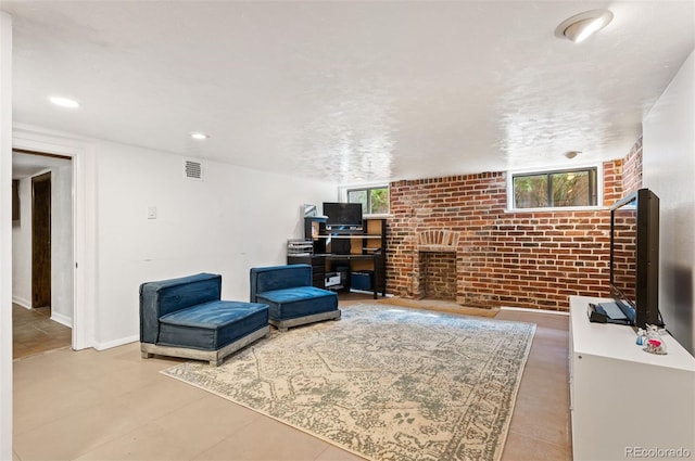 1430 Monroe St, Denver, CO 80206 - living area with brick wall, healthy amount of natural light, a fireplace, baseboards, and tile patterned flooring