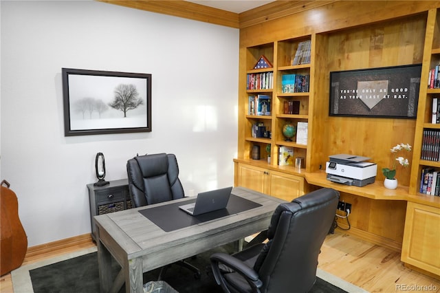 office featuring ornamental molding and light wood-type flooring