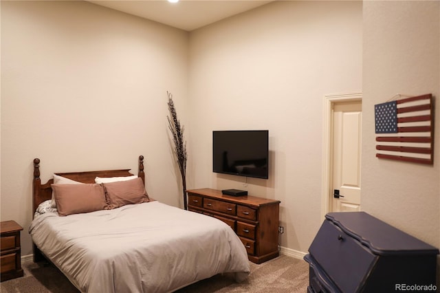 bedroom featuring light carpet