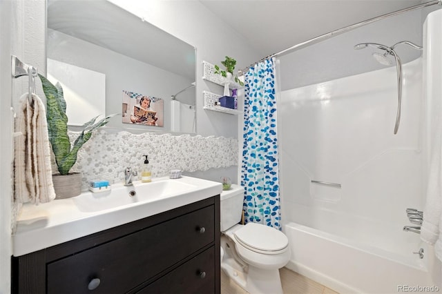 9240 W 49th Ave Unit 317, Wheat Ridge, CO 80033 - full bathroom with vanity, shower / bath combo with shower curtain, toilet, and decorative backsplash