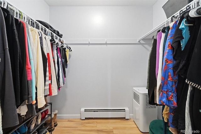 9240 W 49th Ave Unit 317, Wheat Ridge, CO 80033 - spacious closet with baseboard heating and wood finished floors