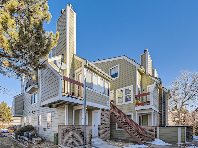 rear view of house featuring a balcony