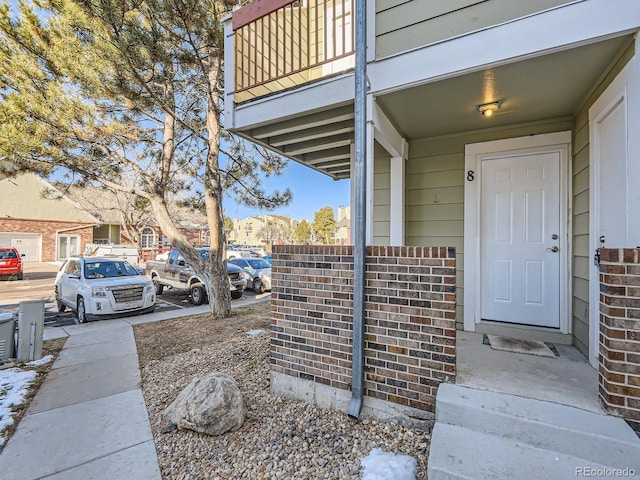 doorway to property featuring a balcony