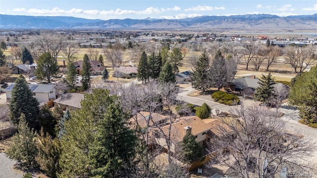 birds eye view of property with a mountain view and a residential view