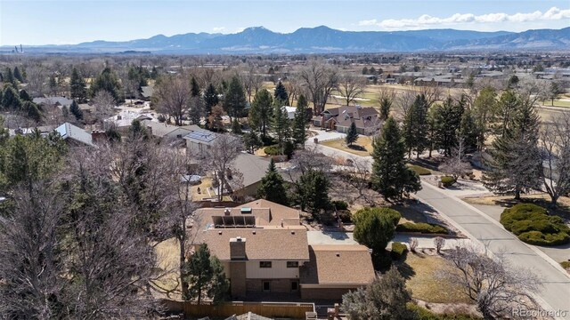 drone / aerial view featuring a mountain view and a residential view