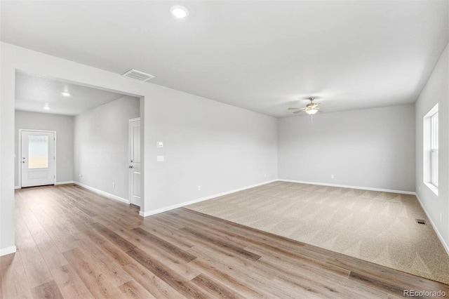 973 Cascade Falls St, Severance, CO 80550 - empty room featuring ceiling fan, baseboards, healthy amount of natural light, and light wood-type flooring