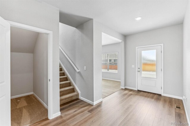 973 Cascade Falls St, Severance, CO 80550 - entrance foyer with stairway, wood finished floors, and baseboards